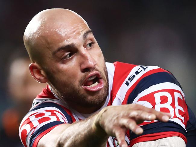 SYDNEY, AUSTRALIA - JUNE 03:  Blake Ferguson of the Roosters offloads the ball in a tackle during the round 13 NRL match between the Sydney Roosters and the Wests Tigers at Allianz Stadium on June 3, 2018 in Sydney, Australia.  (Photo by Matt King/Getty Images)