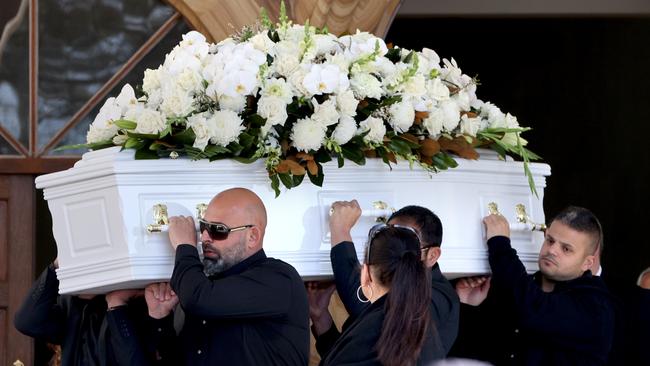 Pallbearers with the coffin after the funeral. Picture: NCA NewsWire