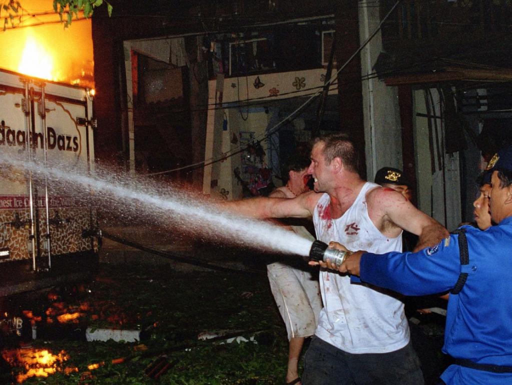 15/10/2002 PIRATE: 12/10/2002.   The first firefighters on the scene tackle the inferno as injured club goers look on in horror, just after a bomb went off in the Sari Club in Bali.   MUST CREDIT Roberto Maldonado/Gamma/Picture Media.  Bali bombings