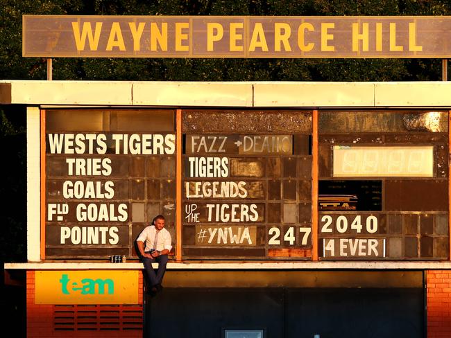 Robbie Farah sits up on the scoreboard drinking beers as the sunsets. Picture : Gregg Porteous