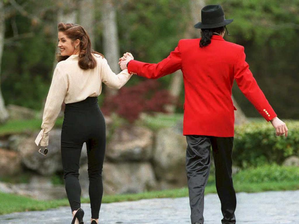 Lisa Marie Presley and then husband Michael Jackson go to greet children at his Neverland ranch in 1995. Picture: AFP PHOTO/Files 