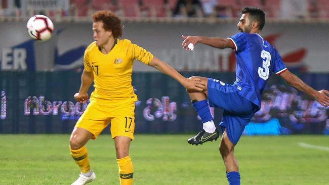 Mustafa Amini tries to get the better of the Kuwait defence.