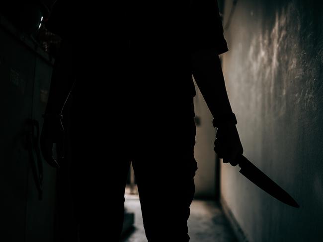 The shadow of a female murderer stood terrifyingly holding a knife and lit from behind.Scary horror or thriller movie mood or nightmare at night Murder or homicide concept. Picture: iStock