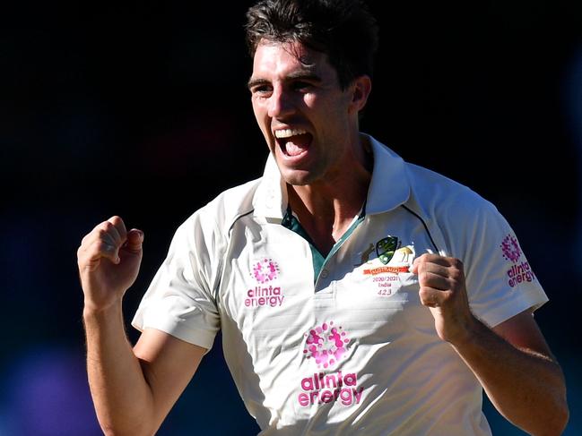 Australia's Pat Cummins celebrates after taking the wicket of India's Rohit Sharma on the fourth day of the third cricket Test match between Australia and India at the Sydney Cricket Ground (SCG) in Sydney on January 10, 2021. (Photo by Saeed KHAN / AFP) / -- IMAGE RESTRICTED TO EDITORIAL USE - STRICTLY NO COMMERCIAL USE --