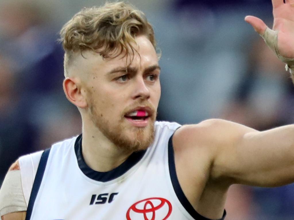 Hugh Greenwood (left) of the Crows is congratulated by Josh Jenkins after kicking a goal during the Round 12 AFL match between the Fremantle Dockers and the Adelaide Crows at Optus Stadium in Perth, Sunday, June 10, 2018. (AAP Image/Richard Wainwright) NO ARCHIVING, EDITORIAL USE ONLY