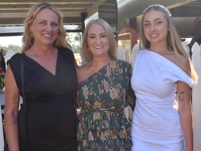 Robyn Halloran, Kelly Budic and Tiela Stevenson at the Yeppoon race day at Keppel Park racecourse on April 26, 2025.
