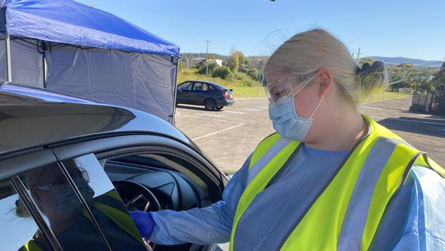 A health worker tests a patient in their vehicle. Picture Amy Ziniak