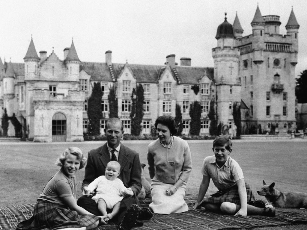 Britain's Queen Elizabeth II, Prince Philip and their children, Prince Charles, right, Princess Anne and Prince Andrew, pose for a photo on the lawn of Balmoral Castle, in Scotland in 1960. (AP Photo/File)