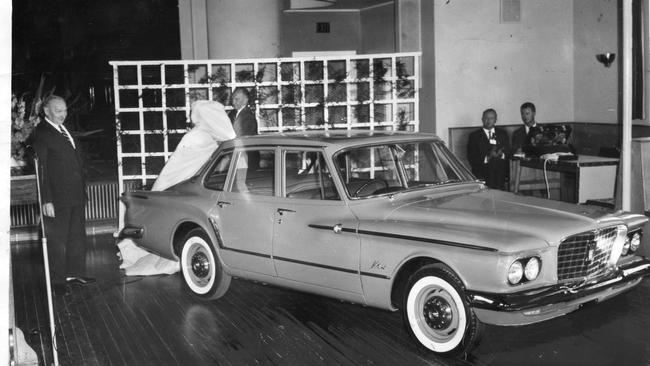 Premier Sir Thomas Playford (left) inspecting the new Chrysler Valiant motor car after he had unveiled it at the Burnside Town Hall in January, 1962.