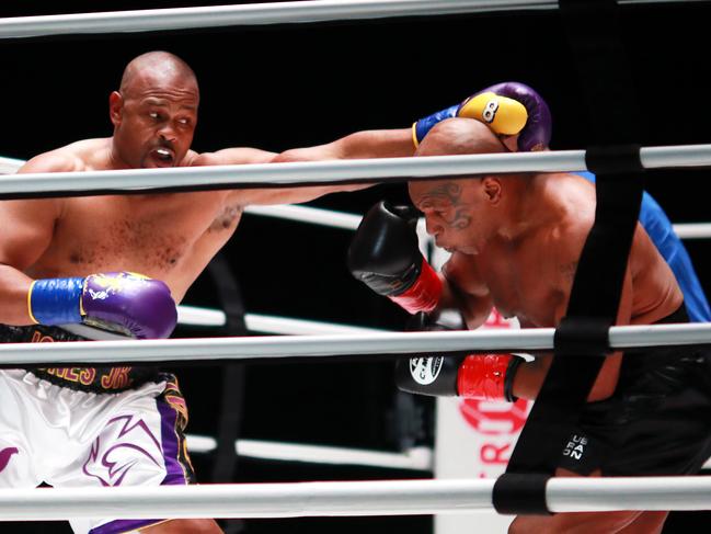 Mike Tyson (R) in his customary all black fighting kit, takes on Roy Jones Jr (L) in a 2020 exhibition match. Picture: Getty Images