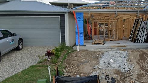 How close can you get? The roofs of these two houses at Holmview are touching.