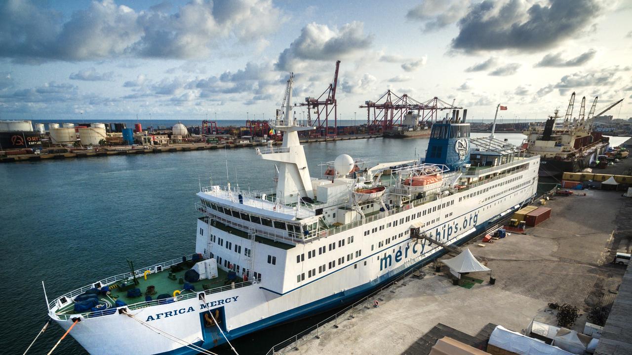 The Africa Mercy as the sun sets over the port of Cotonou, Benin 2017.