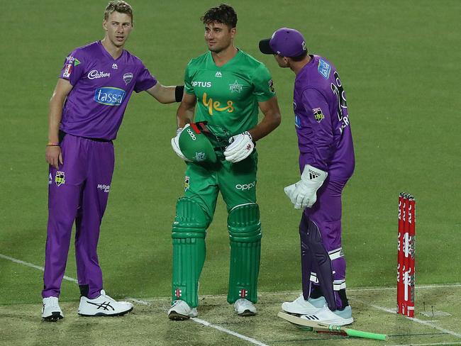 Meredith (left) checks if Stoinis is all right after hitting him in the head with the ball.