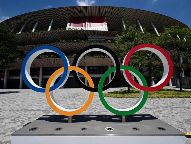 (FILES) This general view shows the Olympic Rings at the Olympic Stadium, main venue of the Tokyo 2020 Olympic Games in Tokyo on July 19, 2021. The lessons Pierre Trochet learned when aged just 20 a business he started up "crashed" served him well as within two decades he succeeded in securing Flag Football a spot at the 2028 Summer Olympics in Los Angeles. (Photo by Philip FONG / AFP)