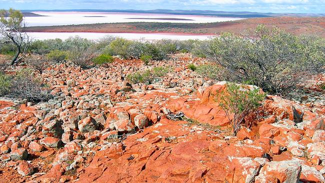 White salt of Lake Gairdner and red rocks at Mt Ive station.