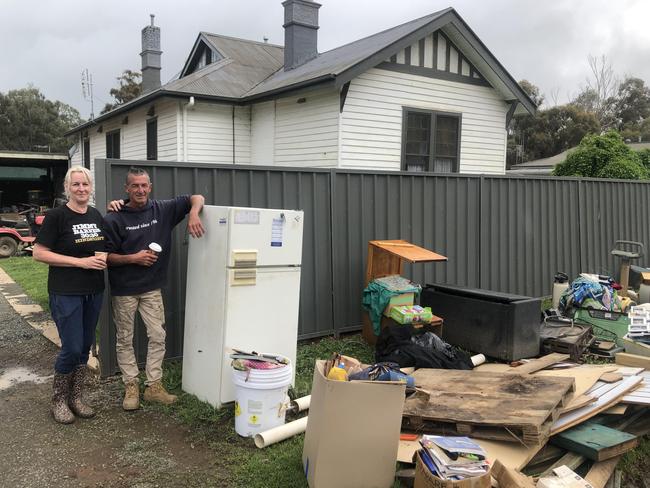 Leisa and Wayne Cody outside their 100-year-old home in Rochester. They are cleaning their home with the intention of laying sandbags to protect it from another potential flood. Picture: Julieanne Strachan