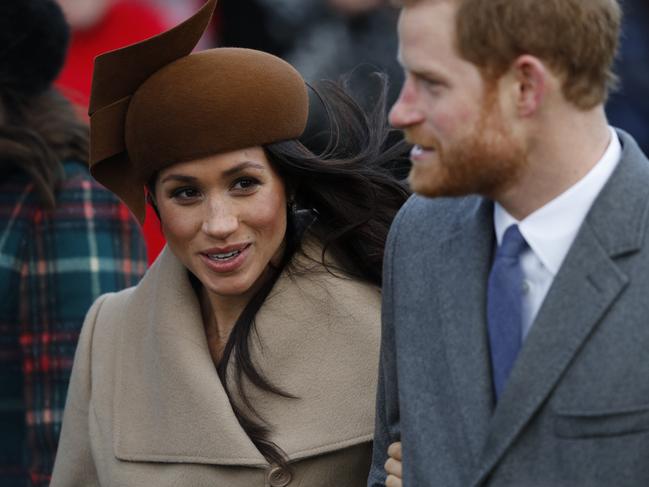 (FILES)  (L-R) US actress and fiancee of Britain's Prince Harry Meghan Markle and Britain's Prince Harry arrive to attend the Royal Family's traditional Christmas Day church service at St Mary Magdalene Church in Sandringham, Norfolk, eastern England, on December 25, 2017. (Photo by Adrian DENNIS / AFP)