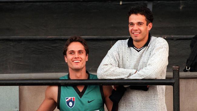 Gavin Wanganeen and Shane Bond watch Port Adelaide train in 1997.