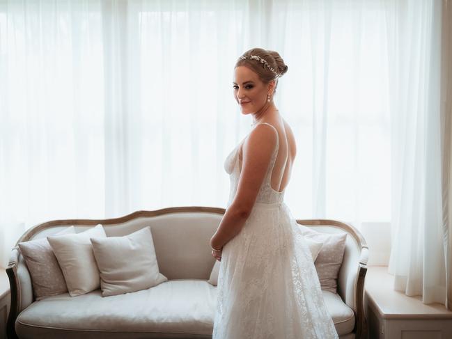 Ashlee’s dress was from Temple by Bo & Luca and her hair was done by a last-minute fill-in found at 9pm the night before the big day. Picture: Feather and Finch Photography