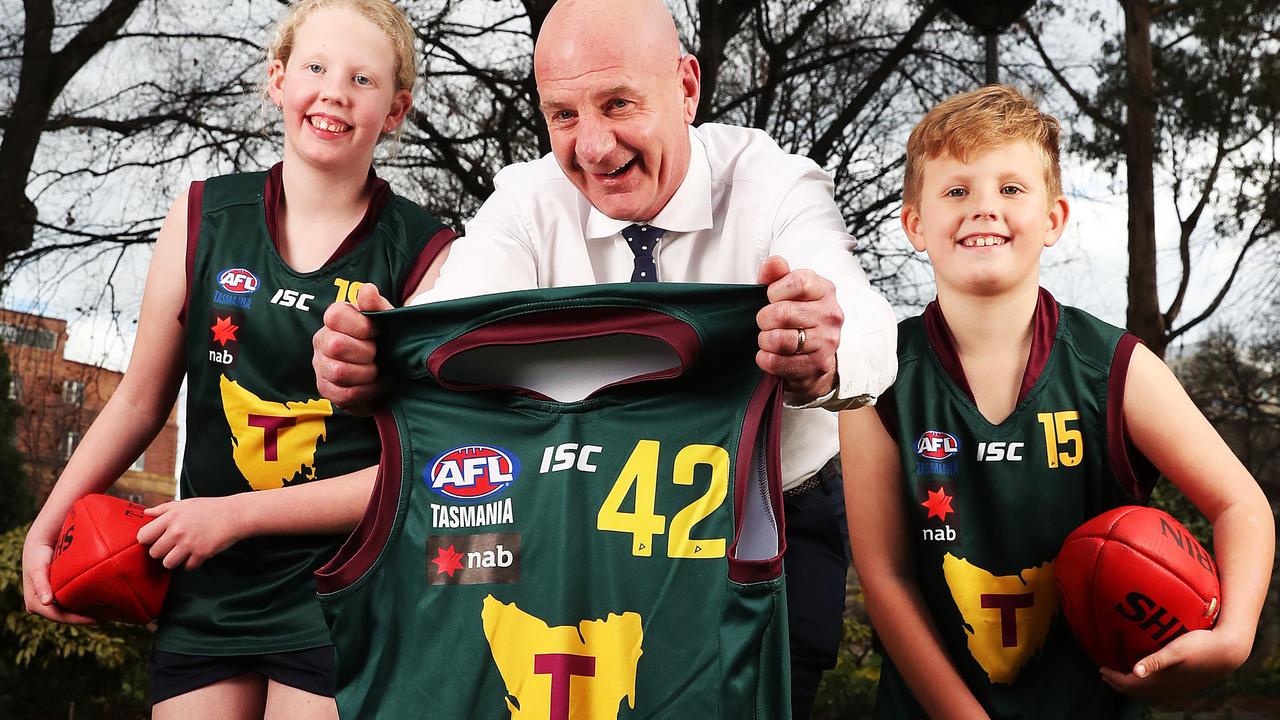 Premier Peter Gutwein with siblings Emily Apted 13 and Bailey Apted 8 of Midway Point. Inspiring passion for Tassie footy ahead of the AFL game at Blundstone Arena. Picture: Nikki Davis-Jones