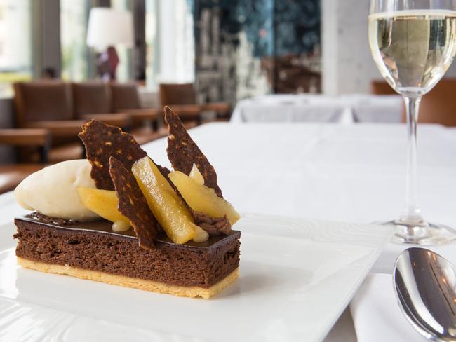 Baked chocolate mousse with caramelised pears and pear sorbet. Picture: Supplied