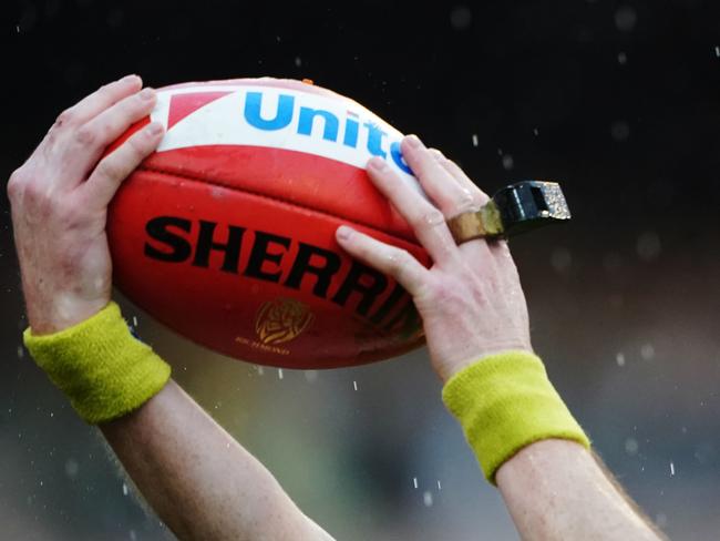 A boundary umpire throws the ball in during the Round 22 AFL match between the Richmond Tigers and the West Coast Eagles at the MCG in Melbourne, Sunday, August 18, 2019. (AAP Image/Michael Dodge) NO ARCHIVING, EDITORIAL USE ONLY