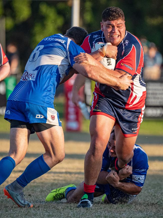 Tugun's Josh Harvey wraps up the ball as Runaway Bay's Doryaan Hape Apiata takes a hit-up. Picture: Kris Matthews