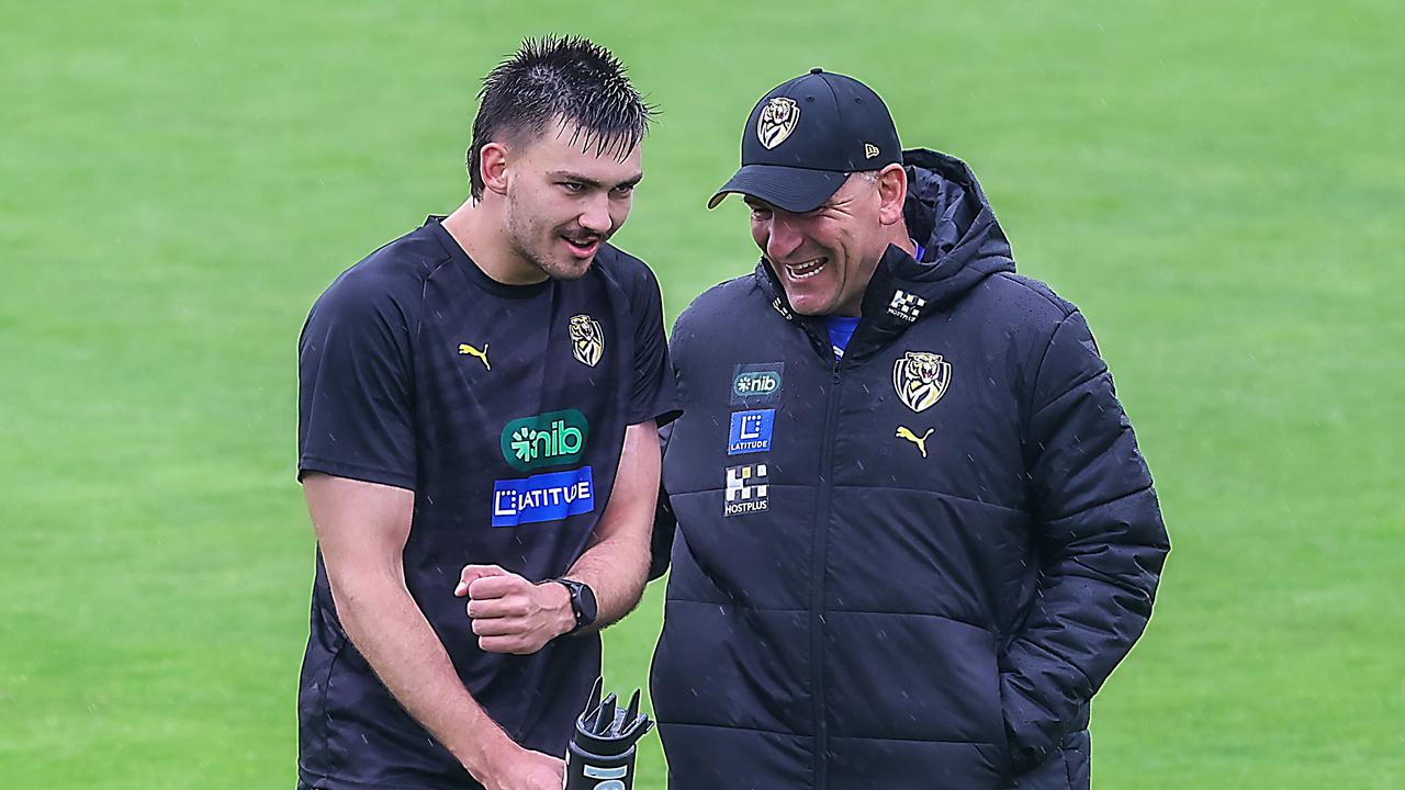 Josh Gibcus chats with coach Adem Yze at training. Picture: Ian Currie