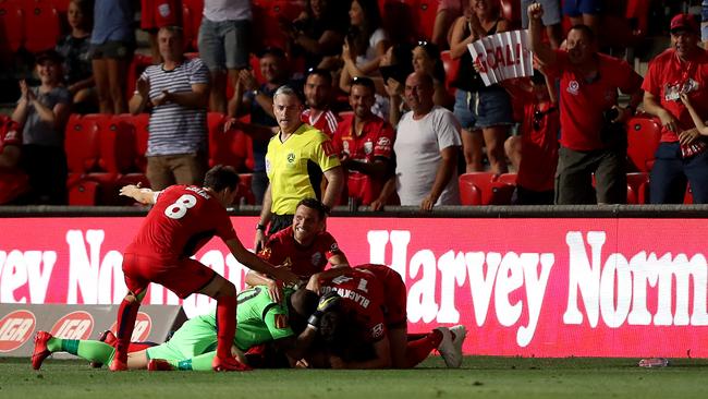 Adelaide United celebrate their winning goal during the round 17 A-League match between Adelaide United and the Brisbane Roar at Coopers Stadium. Picture: James Elsby/Getty Images