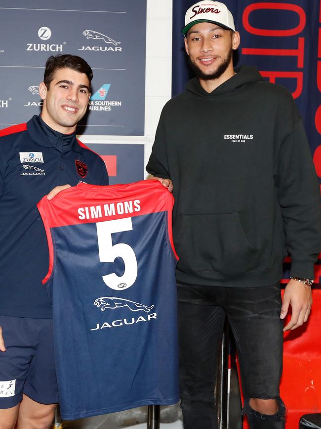 Petracca presents Ben Simmons with a Melbourne jumper.