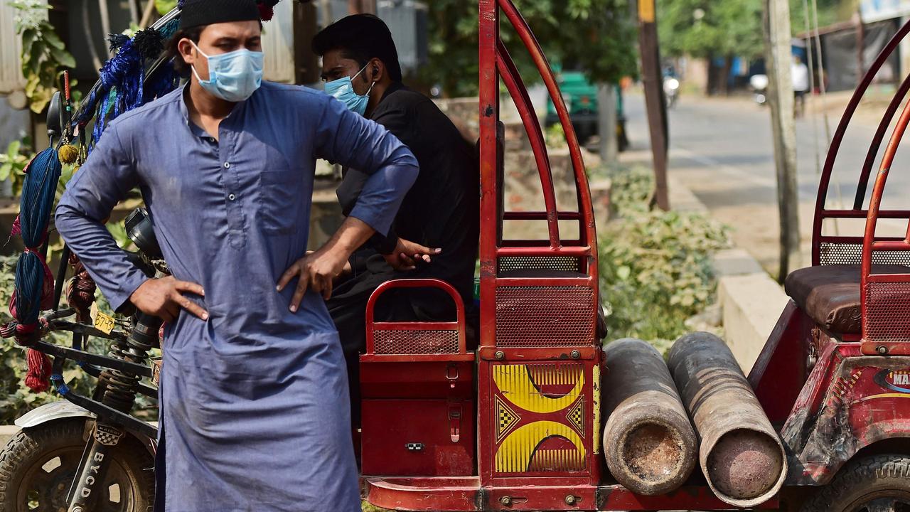 A man waits to refill oxygen cylinders for a relative in Allahabad, India. Picture: Sanjay Kanojia/AFP