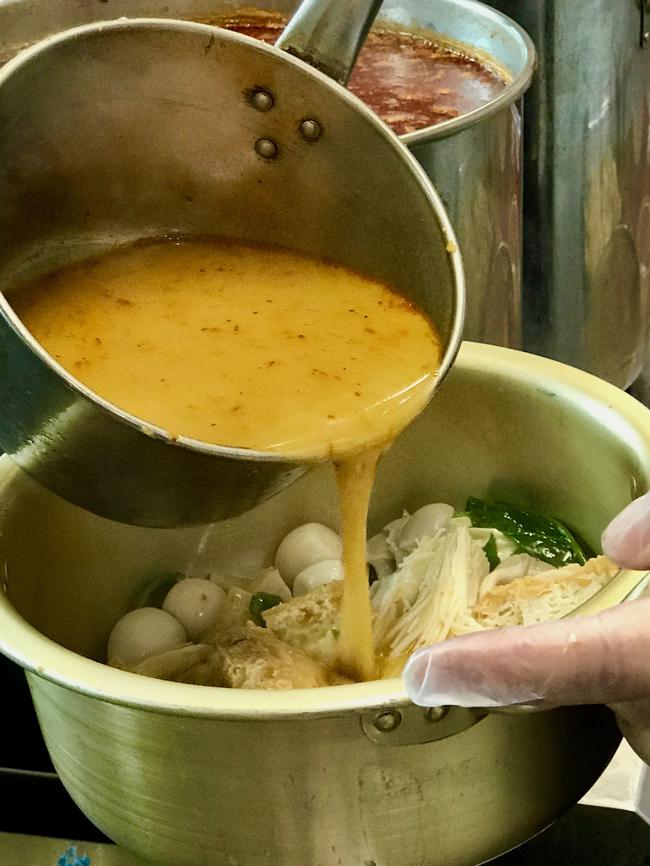 The process of adding the soup broth to the malatang dish. Picture: Jenifer Jagielski