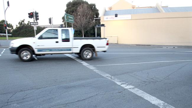 Road line markings around Hobart city. Fading lines near the intersection of Macquarie Street and the Brooker Highway.