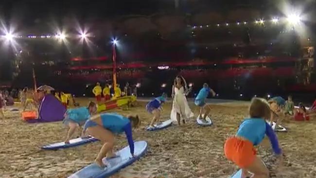 Ricki-Lee Coulter performs with a group of surf lifesavers at the dress rehearsal. Picture: Channel 7