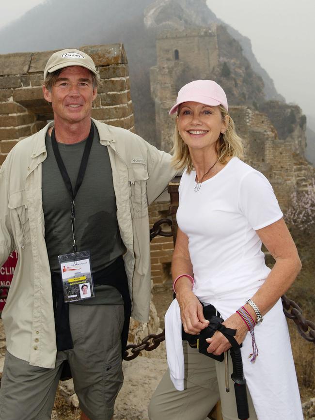 Olivia Newton-John and former husband Patrick McDermott walking the Great Wall of China in 2008 to raise money for a new Cancer and Wellness Centre at Melbourne's Austin Hospital. Picture: Andrew Raszevski.