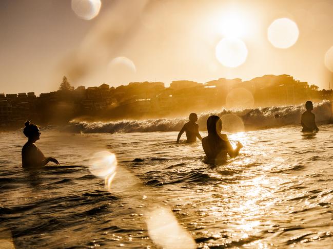 Swimmers enjoying Bondi beach today amid the searing heat. Picture: Brook Mitchell/Getty Images)