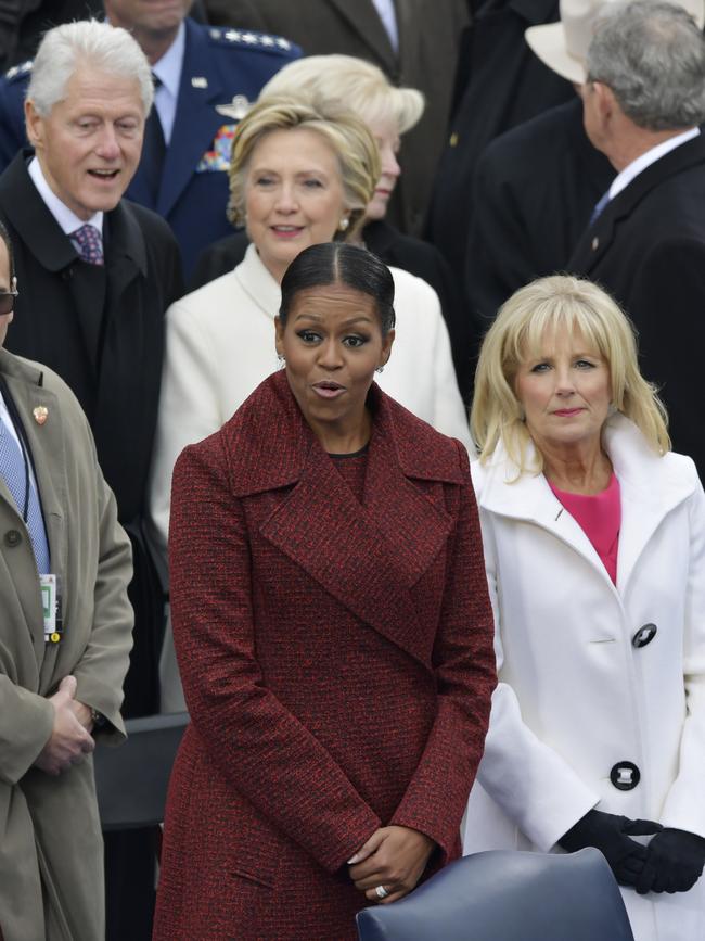 First Lady Michelle Obama stands with Vice President Joe Biden’s wife, Dr. Jill Biden for the 58th Presidential Inauguration for President-elect Donald Trump at the U.S. Capitol in Washington on January 20, 2017. Picture: AP
