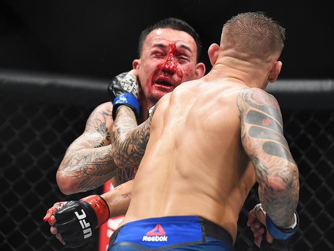 Dustin Poirier (right), beat Max Holloway for the interim lightweight title in 2019. Picture: Getty Images