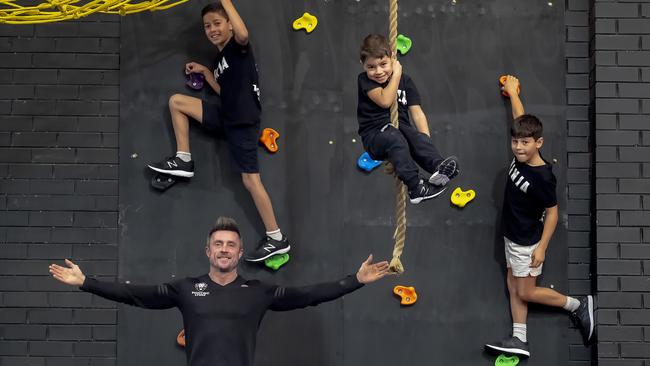 Paul Lyons in 2018 with young ninjas-in-training Daniel, Julian and Jude Saccuzzo. Picture: Luis Enrique Ascui