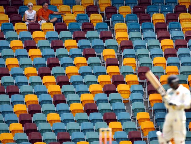 A batsman cuts a lonely figure against a near-empty grandstand at an Australia-Sri Lanka Test at the Gabba.