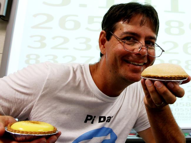 Maths teacher Bryson McMillen tries a pie on Pi Day. Picture: Peter Kelly