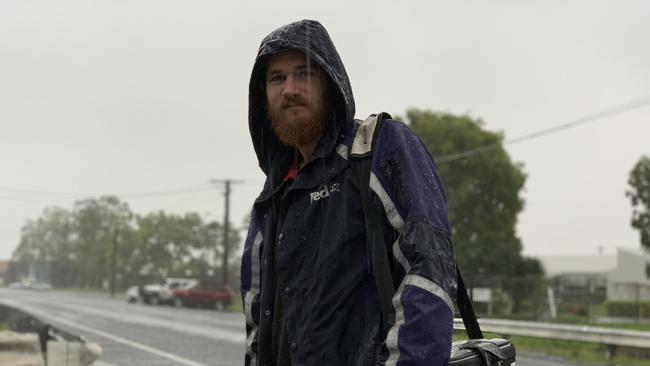 Mackay resident John Hoare, who is a panel beater, on his way to work during the January 2023 big wet. Picture: Duncan Evans