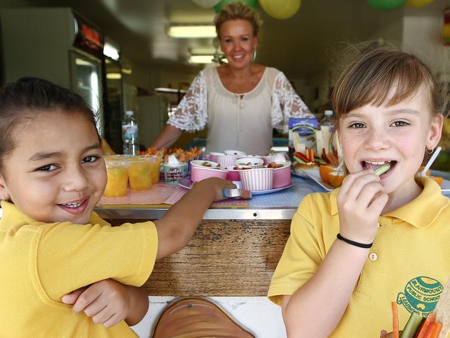 **WARNING** Embargoed until 5th of December. Pictured are students Ella Fretton 5 and Alyssah Price 7 with canteen lady Kathy Low, at Blairmount Public School today which has a healthy school canteen. Picture: Tim Hunter.