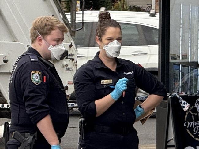 Forensics inspecting Merrylands Barber Shop on Merrylands Rd in Merrylands after a suspected arson attack with police believing a man caught alight while trying to set the shop alight. Picture