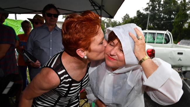 One Nation leader Senator Pauline Hanson kisses Labor MP Jo-Ann Miller on the cheek. Picture: AAP Image/Darren England