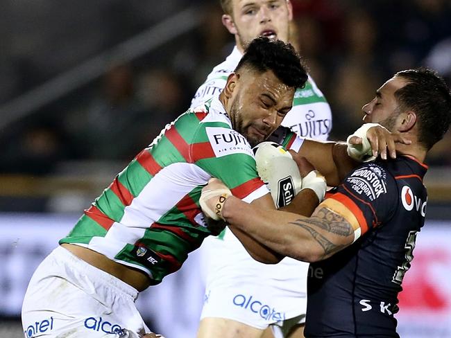 Zane Musgrove of the Rabbitohs is tackled by Jacob Lillyman, left, and Bodene Thompson of the Warriors during the Round 23 NRL match between the New Zealand Warriors and South Sydney Rabbitohs at Mount Smart Stadium in Auckland, New Zealand on Saturday, August 13, 2016. (AAP Image/David Rowland) NO ARCHIVING, EDITORIAL USE ONLY