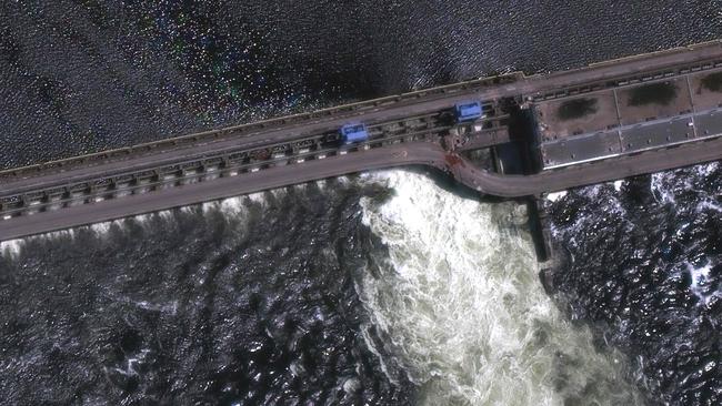 This handout satellite image courtesy of Maxar technologies taken on shows an closer view of Nova Khakovka dam in south Ukraine, on May 28, 2022. Ukrainian President Volodymyr Zelensky will urgently convene his Security Council on June 6, 2023 after an explosion at the Kakhovka hydroelectric dam in the south of the country, a top adviser said. (Photo by Satellite image Â©2023 Maxar Technologies / AFP) / RESTRICTED TO EDITORIAL USE - MANDATORY CREDIT 