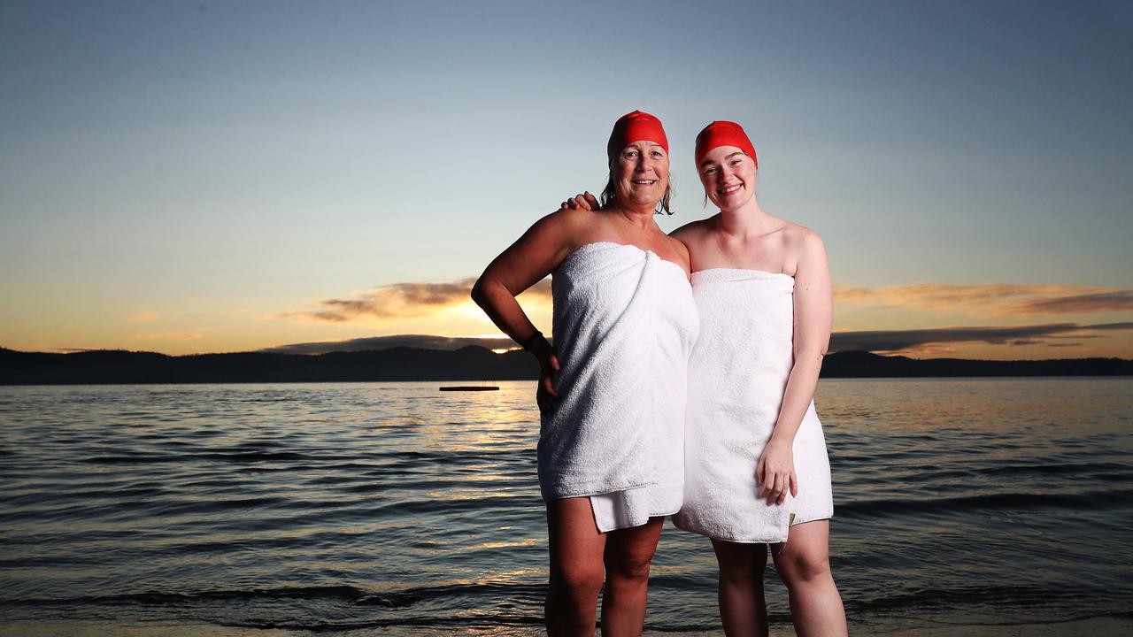 Andrea Bayliss with daughter Molly Florence from Melbourne who took part for the first time. Nude Solstice Swim at Long Beach Sandy Bay as part of Dark Mofo 2022. Picture: Nikki Davis-Jones