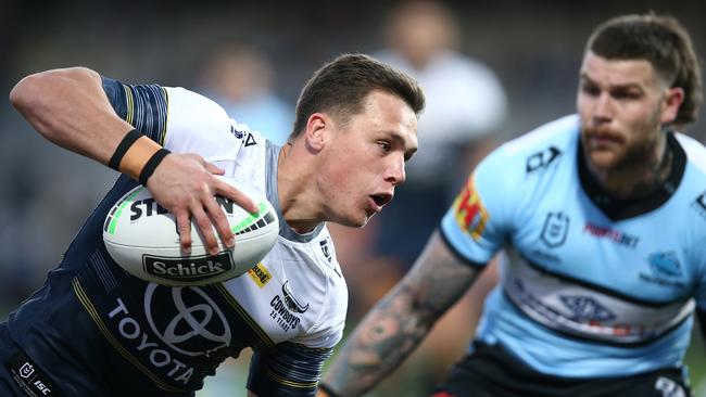 Scott Drinkwater of the Cowboys runs the ball during the round 16 NRL match between the Cronulla Sharks and the North Queensland Cowboys. (Photo by Jason McCawley/Getty Images)