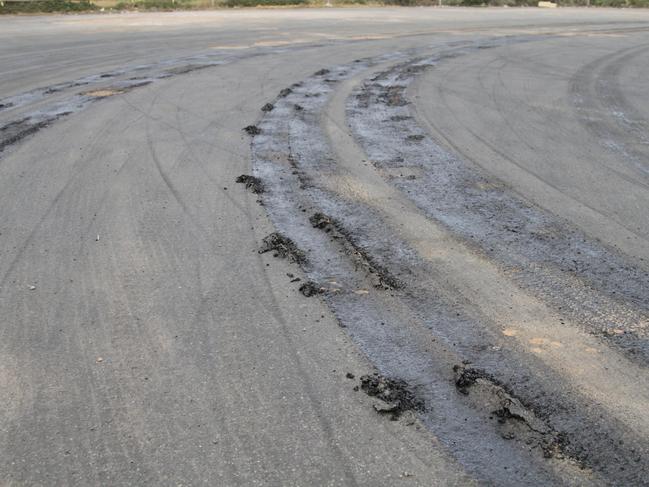 Truck tyres cut up a melted road in Ceduna on Thursday. Picture: Andrew Brooks